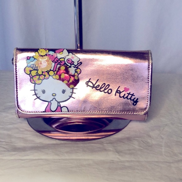 HELLO KITTY metallic pink wallet. Holds up to 16 cards. Polka dot lining inside. - Picture 2 of 16